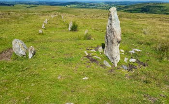 Dartmoor prehistoric small standing stones on open grassy moor