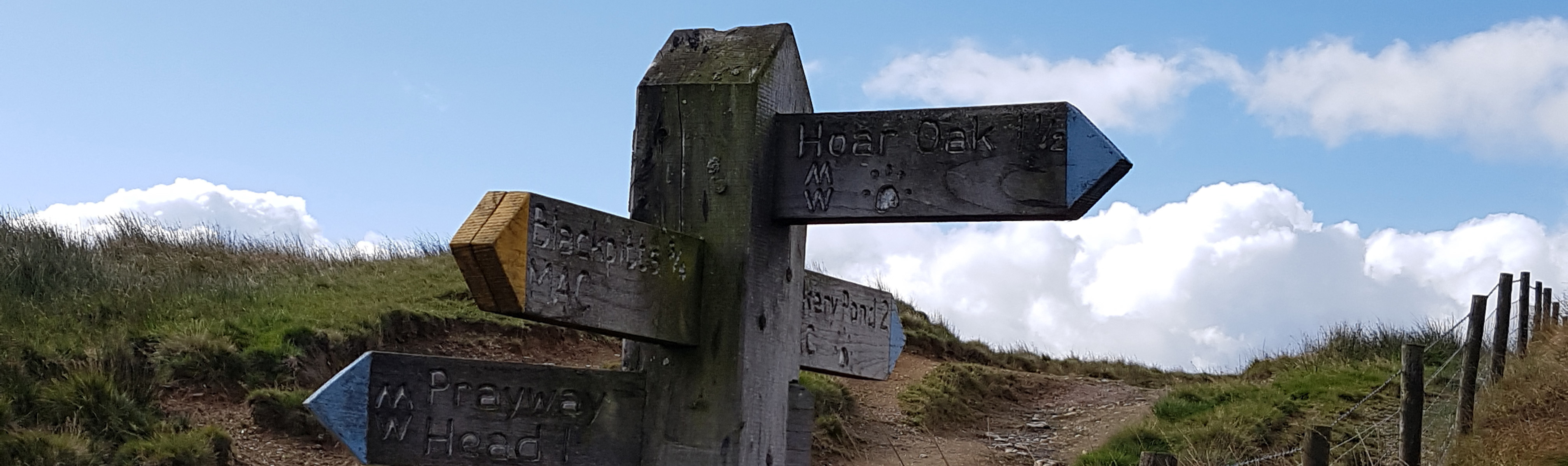 Four wooden signposts for walks