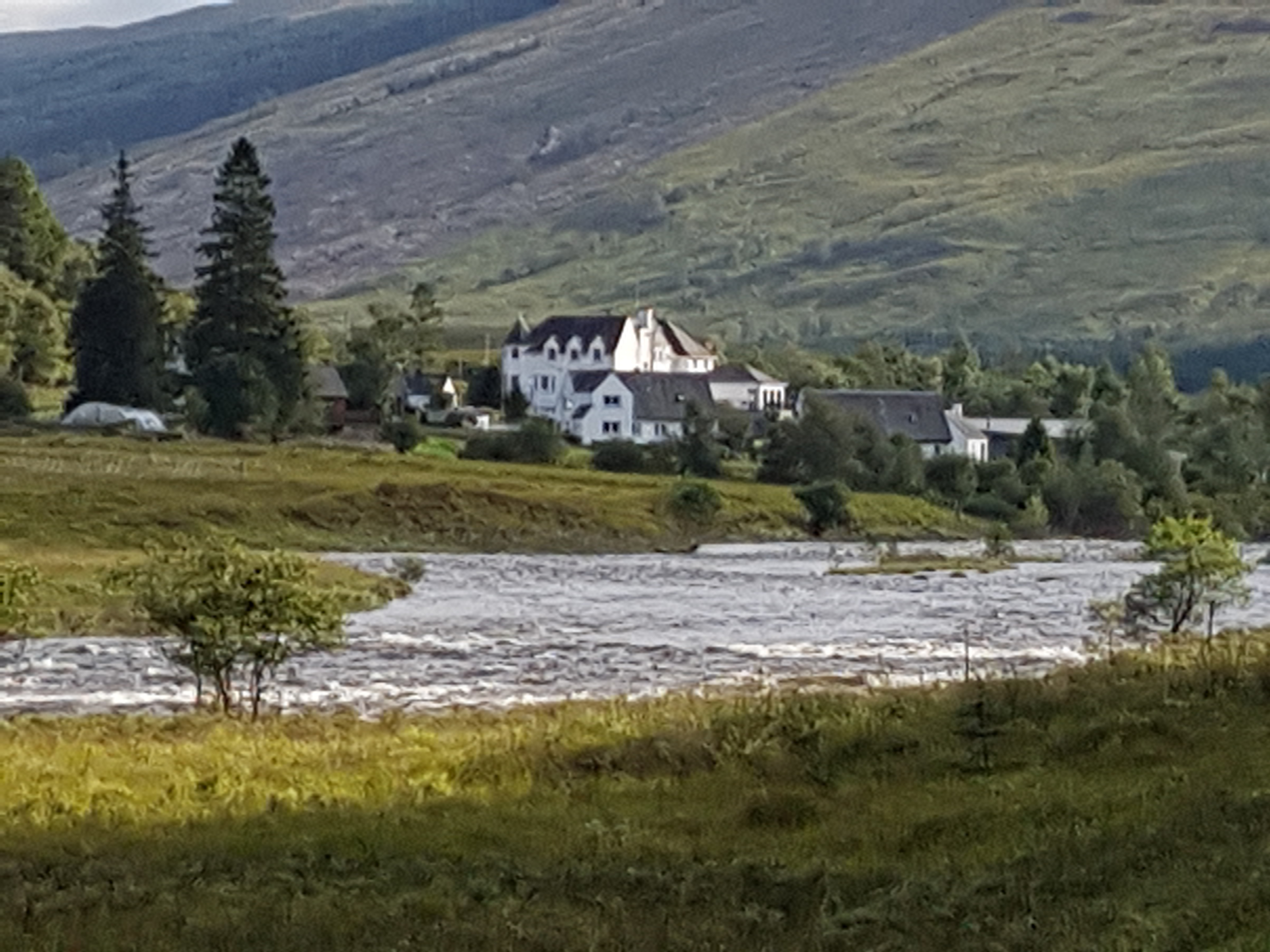West highland way white hotel building by river