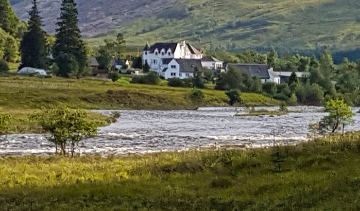 West highland way white hotel building by river