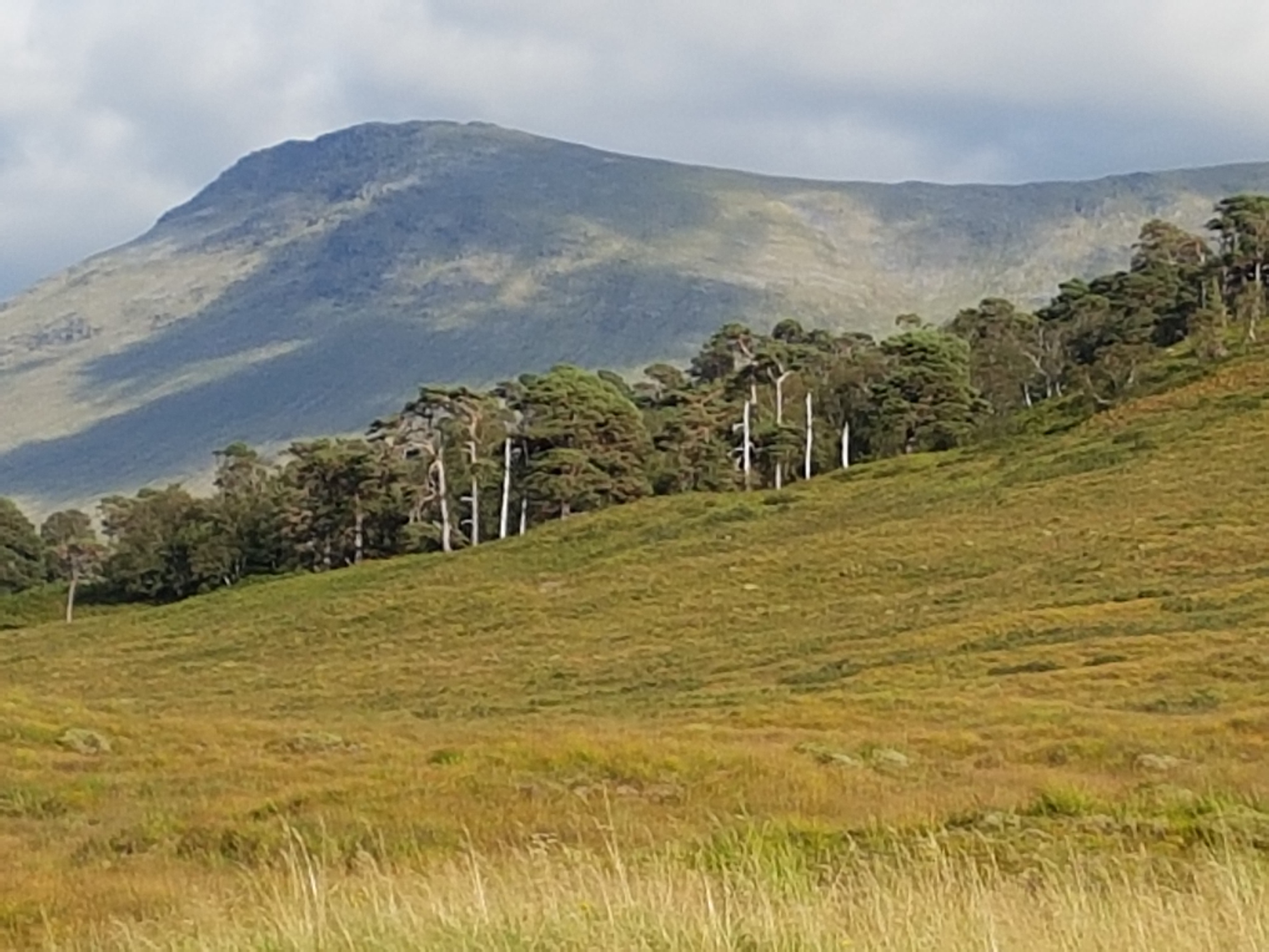 Sunlight and clouds on hills near inveroran