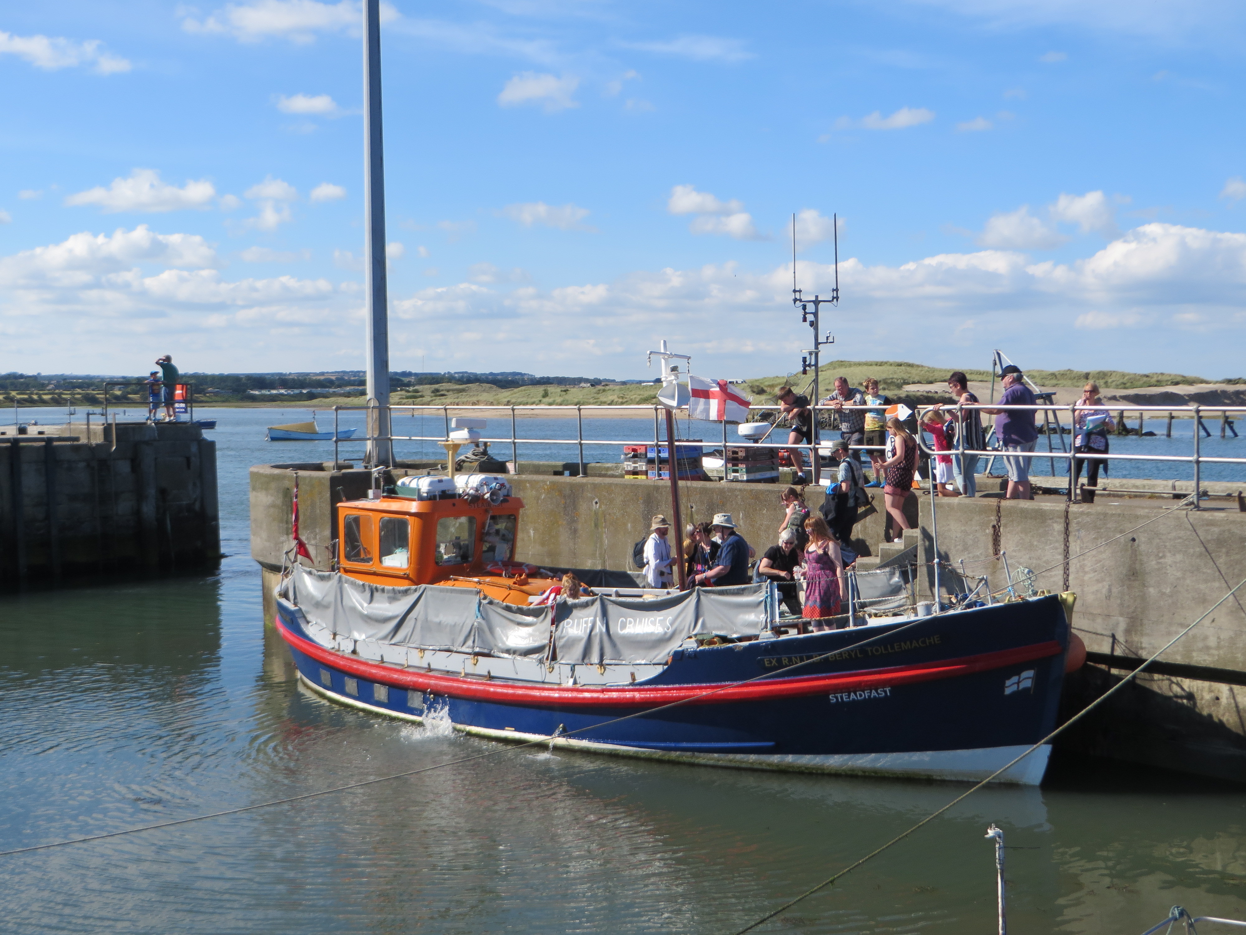 Boat moored to harbour wall Northumberland