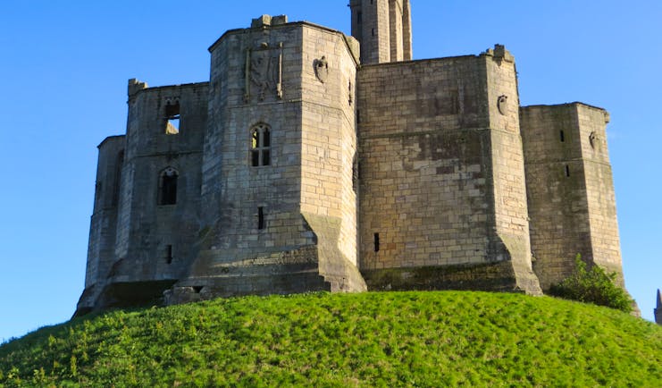 Keep of mediaeval castle on hilltop Northumberland