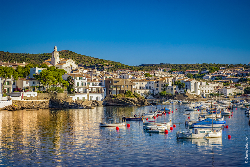 White village on coast with fishing boats