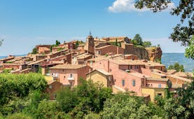 Pink-tinged houses on hill village of Roussillon in Luberon Provence