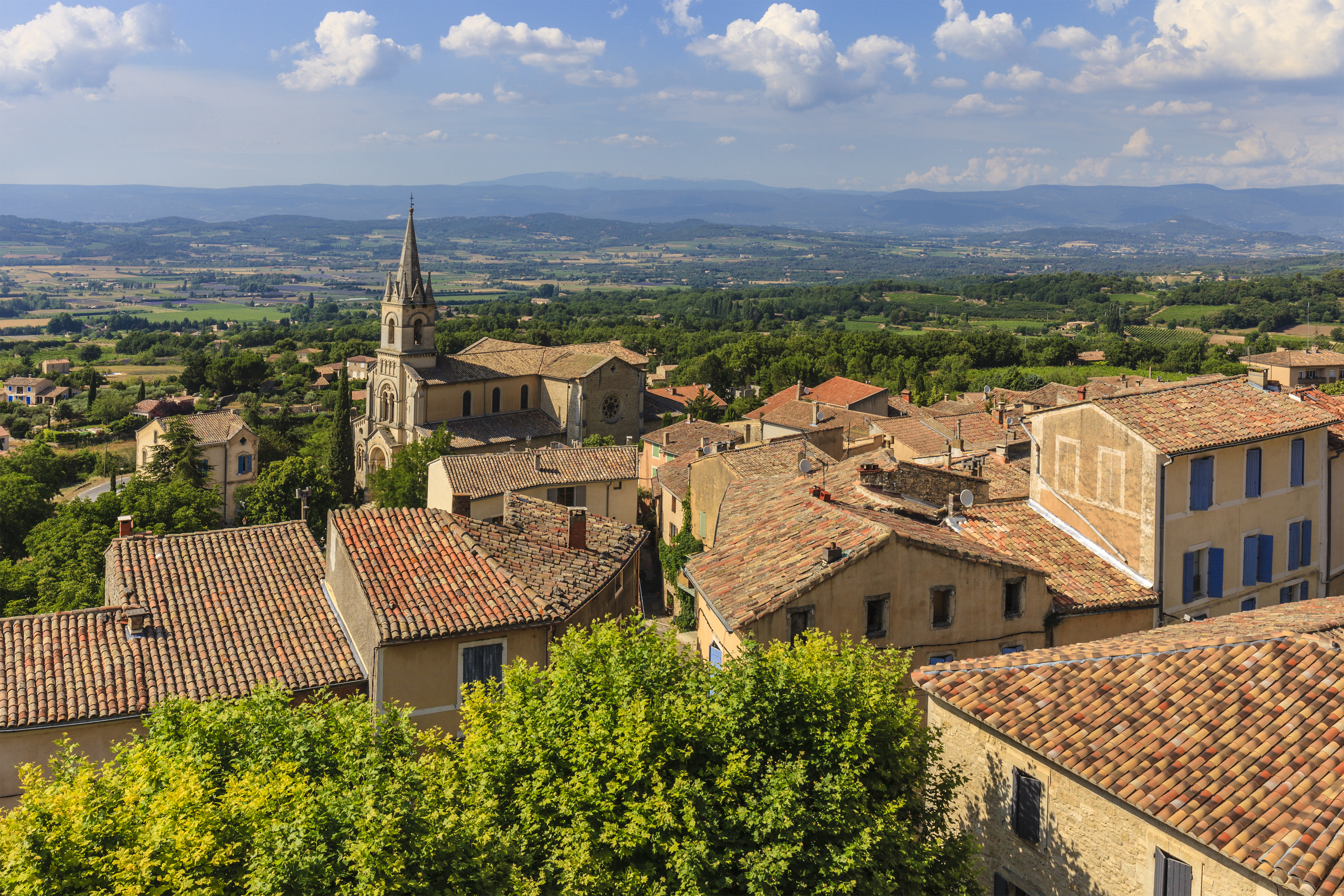 View of the houses of the Luberon village of Bonnieux with tiled roofs