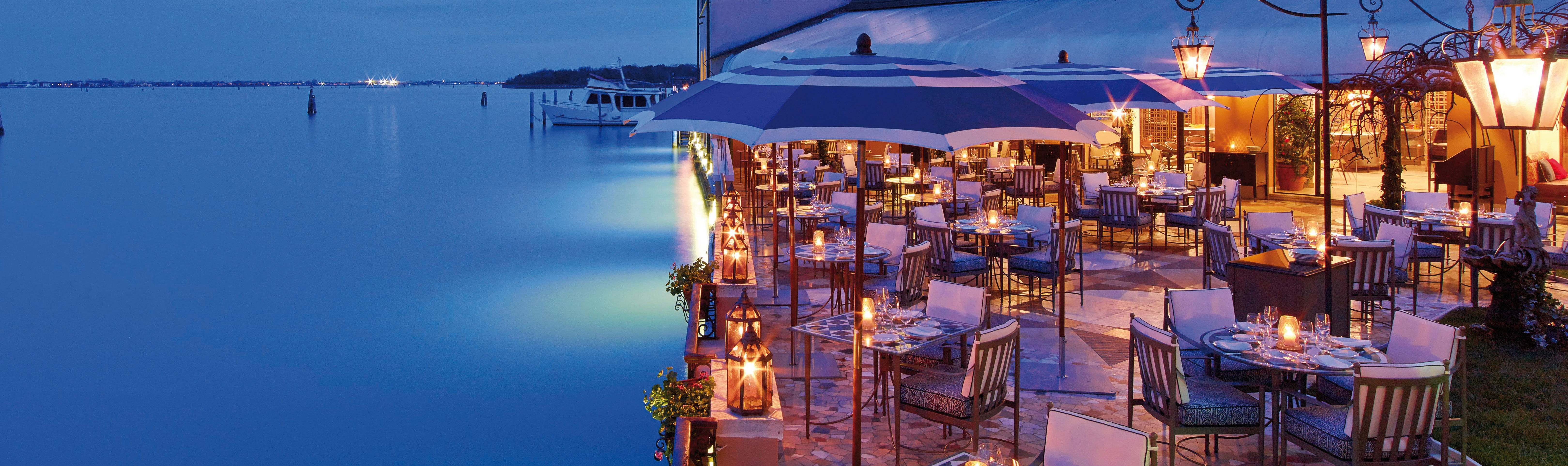 Terrace next to water with evening light for dining