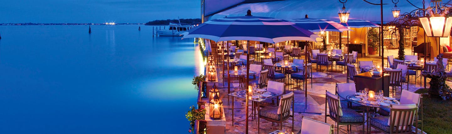 Terrace next to water with evening light for dining